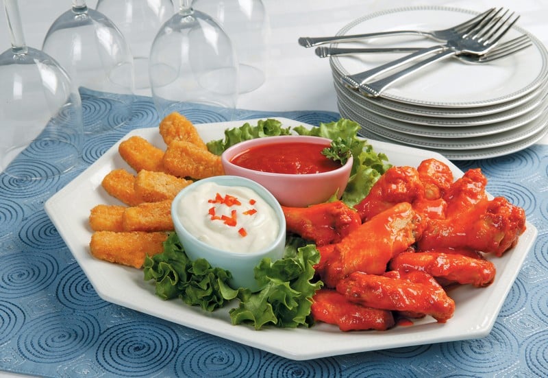 Wings and Mozzarella Sticks with Dipping Sauces on White Dish Food Picture