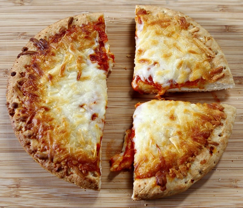 Personal Cheese Pizza on Bamboo Cutting Board Food Picture