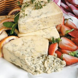 Stilton English Cheese with Garnish and Strawberries on White Dish Food Picture