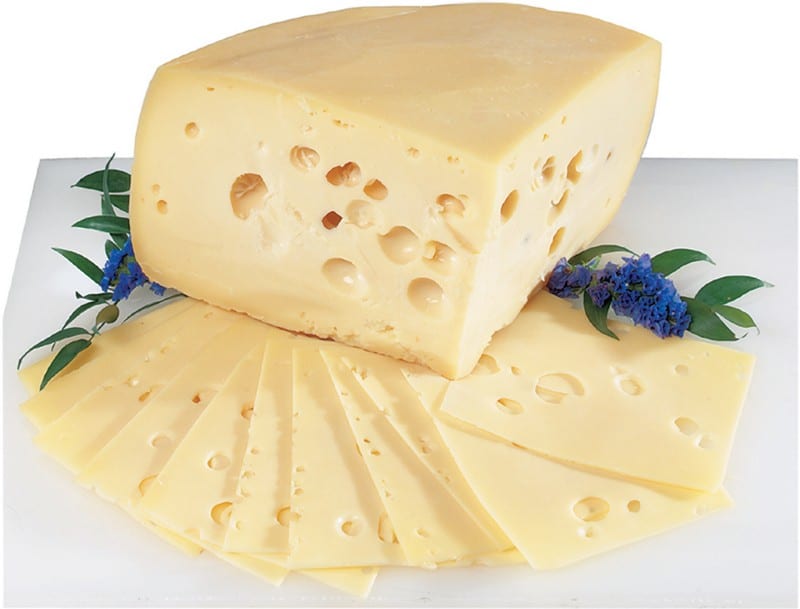 Swiss Cheese with Garnish on White Surface Food Picture