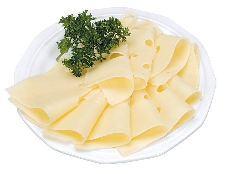 Sliced Swiss Cheese with Garnish on White Plate Food Picture