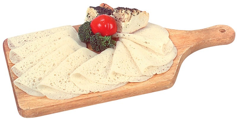 Swiss Cheese with Garnish on Wooden Board Food Picture