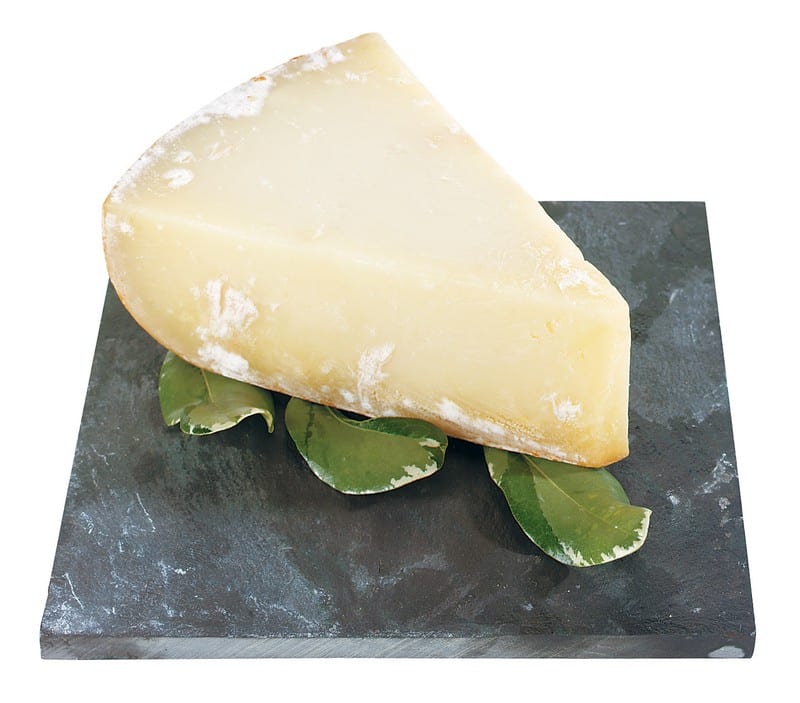 Tome Agour Cheese with Garnish on Stone Slab Food Picture