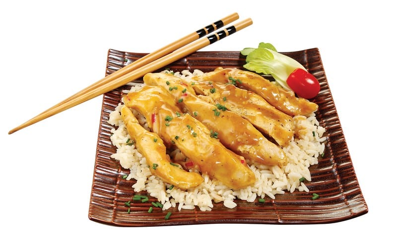 Asian Chicken over Rice on Dark Plate Food Picture