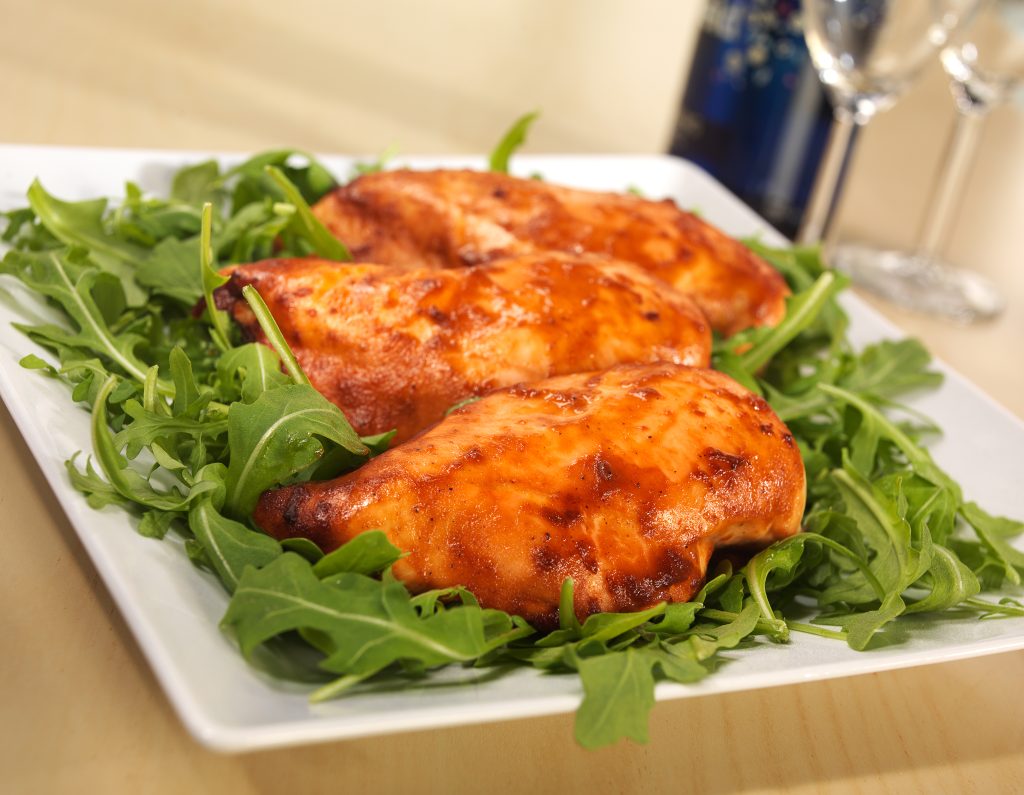 Plate of BBQ Baked Chicken on Arugula Food Picture