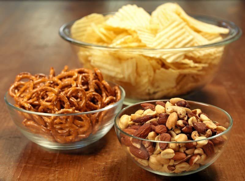 Bowls of Ripple Potato Chips, Mixed Nuts and Braided Pretzel Snacks Food Picture