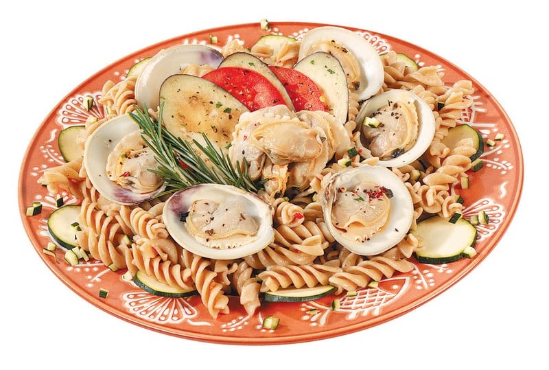 Clams Over Pasta With Garnish On Orange And White Plate Food Picture