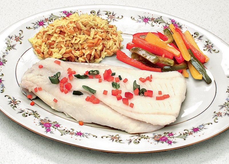 Cod Fillet with Rice and Veggies on White Decorative Dish Food Picture