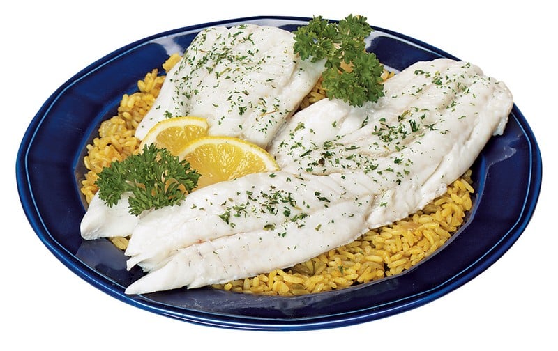 Cod Fillet over Yellow Rice with Garnish on Blue Dish Food Picture