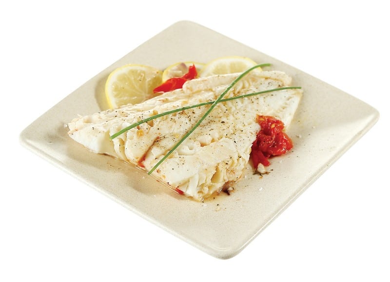 Cod Fillet with Garnish on White Plate Food Picture