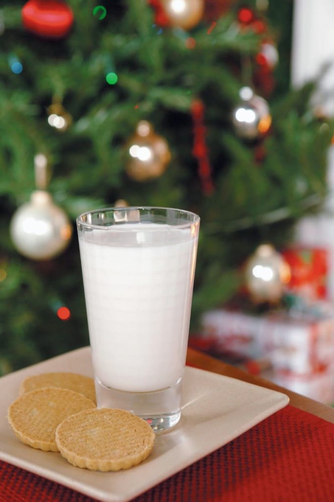 Cookies and Milk in front of Christmas tree Food Picture
