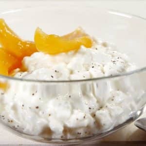 Fresh Cottage Cheese with Syrup Peaches in Glass Bowl Food Picture