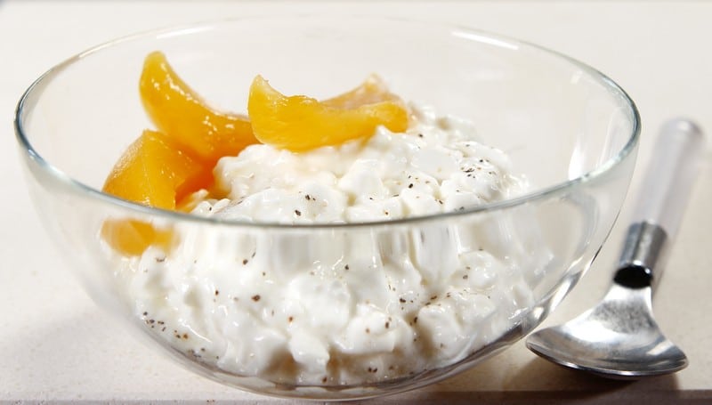 Fresh Cottage Cheese with Syrup Peaches in Glass Bowl Food Picture
