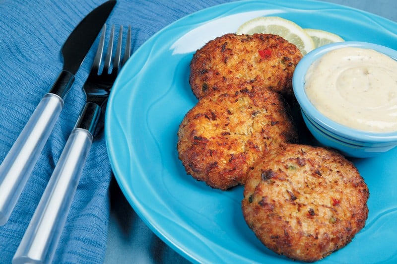 Crab Cakes with Dipping Sauce on Blue Plate Food Picture