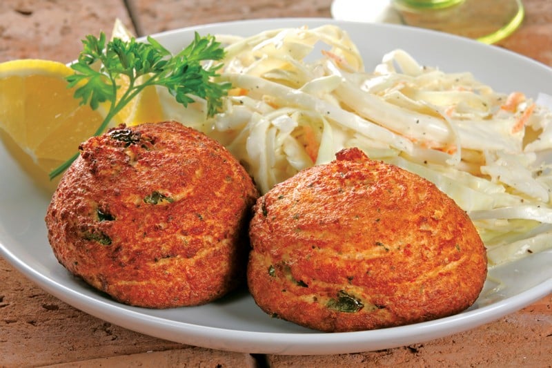 Crab Cakes with Coleslaw and Garnish on White Plate Food Picture