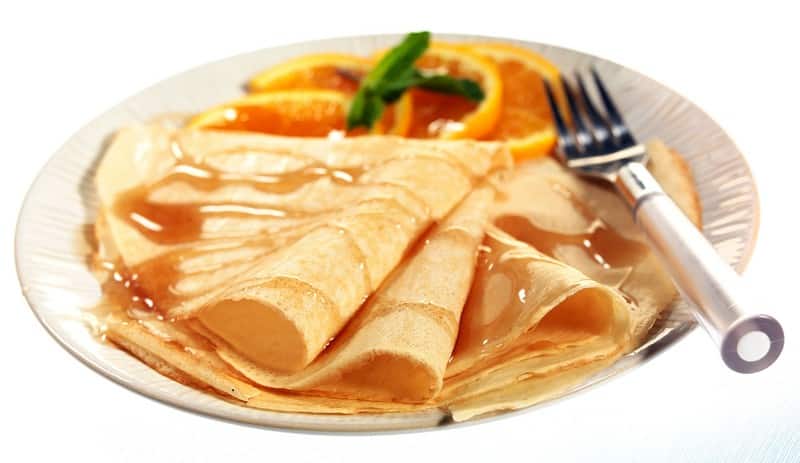 Freshly Made CrÍpe Suzette with Sliced Oranges Food Picture