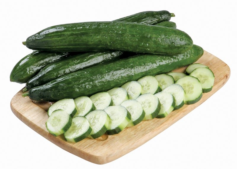 Whole and Sliced English Cucumbers on Board Food Picture