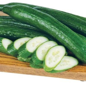 Whole and Sliced Seedless Cucumbers on Board Food Picture