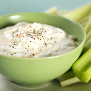 Bowl of Vegetable Dip with Celery Sticks Food Picture