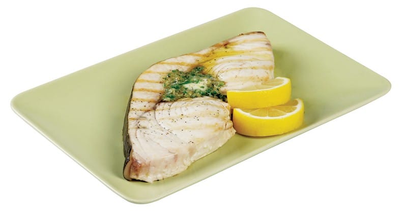 Dog Fish With Garnish and Lemon Wedges on Green Plate Food Picture