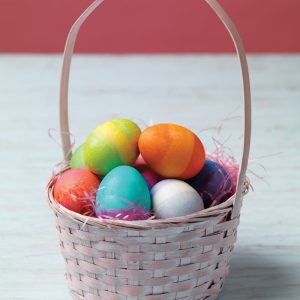 Easter Eggs in Light Pink Basket on Wooden Surface Food Picture