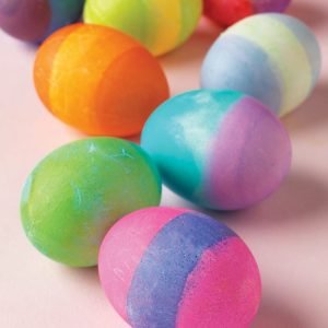 Loose Easter Eggs on Light Pink Surface Food Picture