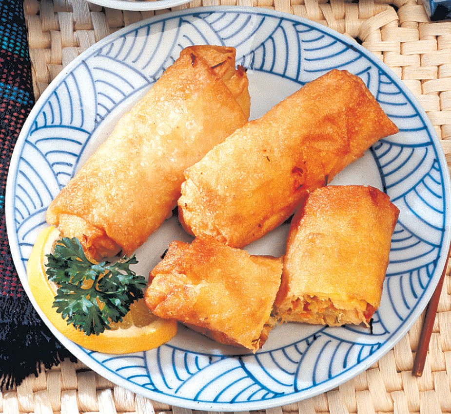 Egg Roll on Blue and White Plate with Garnish Food Picture