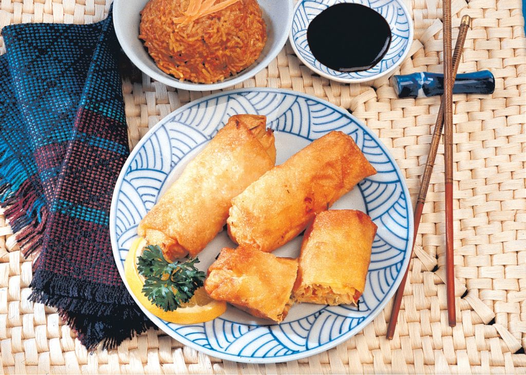 Egg Rolls with Garnish on Blue and White Plate Food Picture