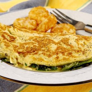 Eggs Florentine Omelet with Golden Hash Browns Food Picture