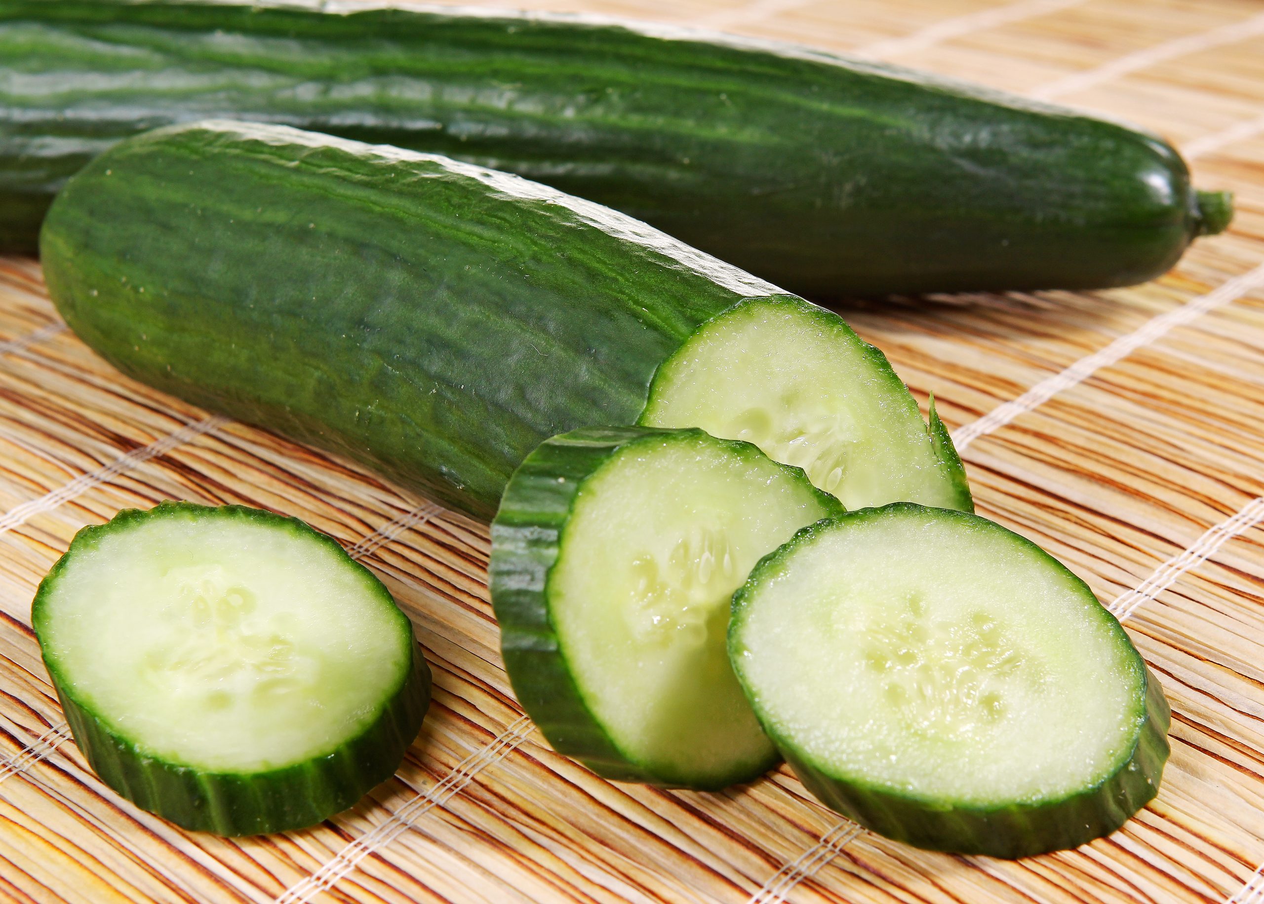 Whole & Sliced Fresh English Seedless Cucumber on Table Food Picture
