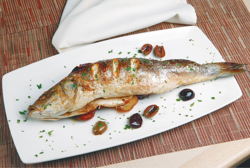 Baked Fish with Garnish and Seasoning on White Plate Food Picture
