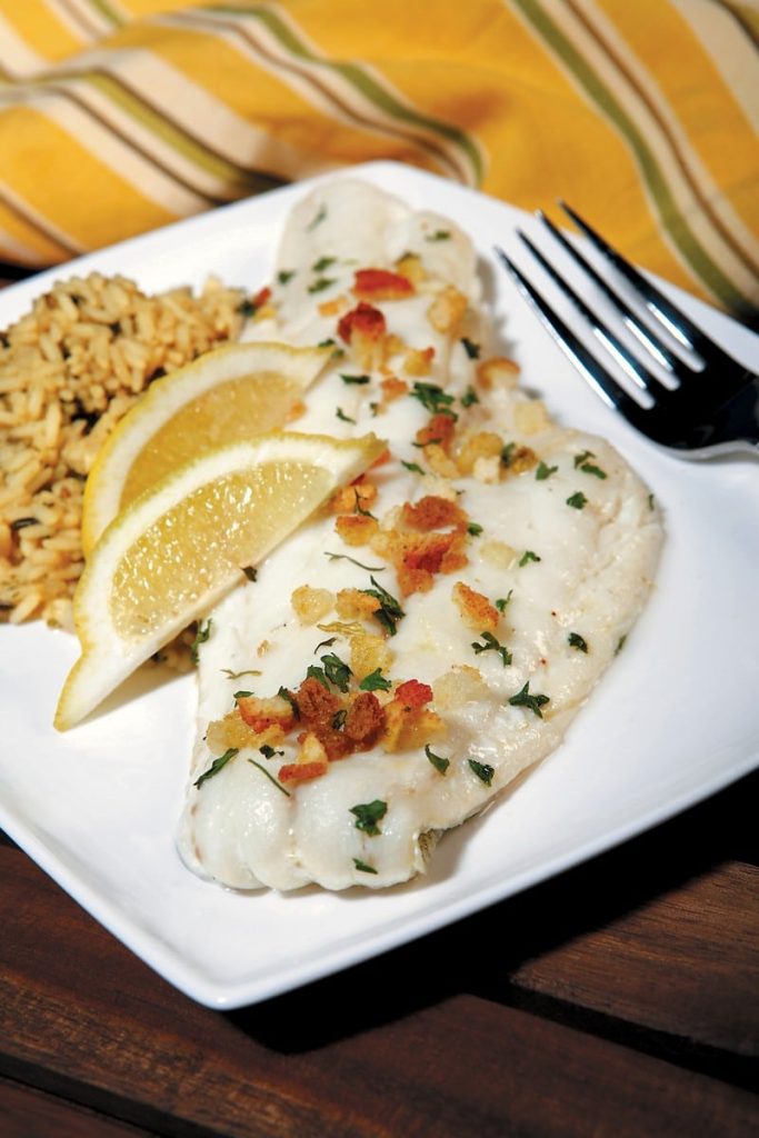 Fish Fillet with Rice and Lemon Wedges on White Plate Food Picture