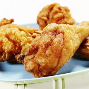 Fresh Country Fried Chicken Drumsticks on a Periwinkle Plate Food Picture