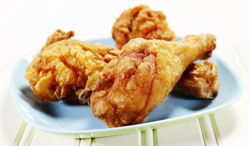 Fresh Country Fried Chicken Drumsticks on a Periwinkle Plate Food Picture