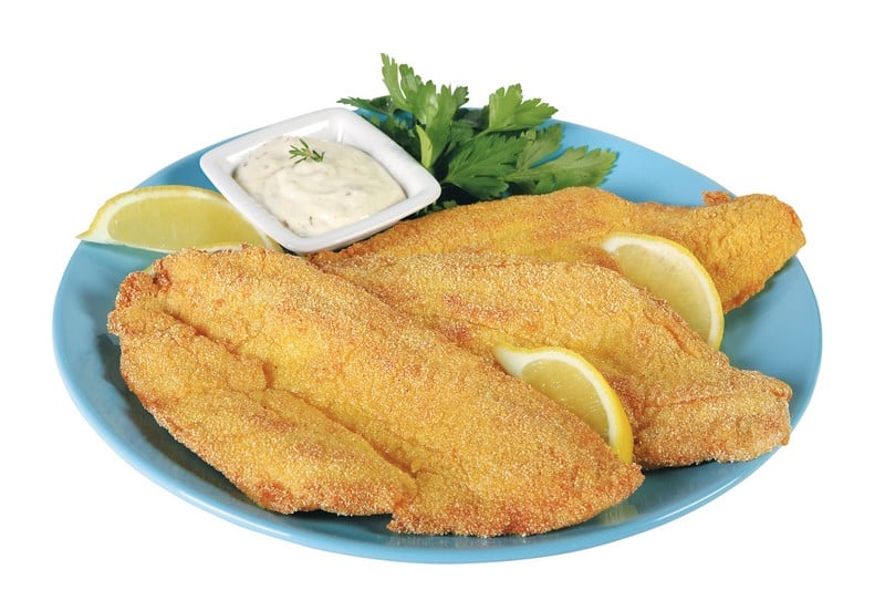 Fried Flounder with Lemon Wedges, Dipping Sauce, and Garnish on Blue Plate Food Picture
