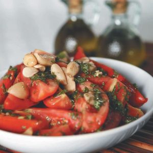Garlic Tomatoes and Olive Oil in a Bowl Food Picture