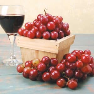 Box of Red Grapes with Wine Food Picture