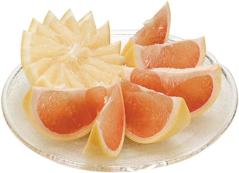 Grapefruit Slices on a Glass Plate Food Picture