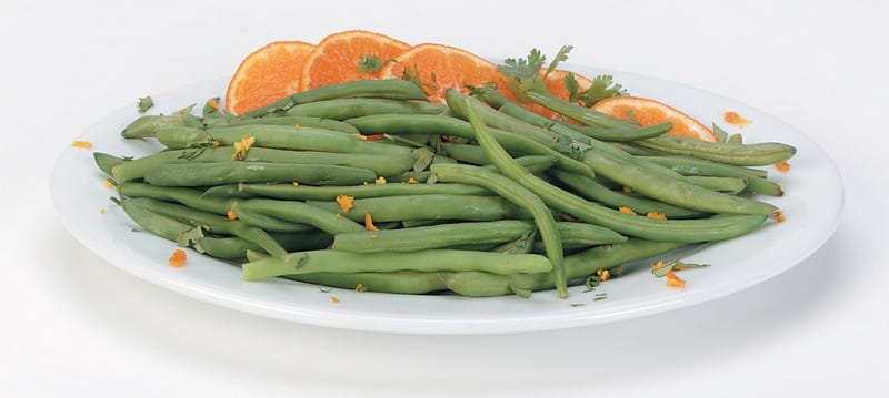 Orange Slices and Green Beans on a Plate Food Picture