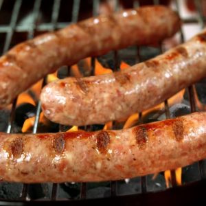 Three Fresh Bratwurst Sausages on Charcoal Grill Food Picture