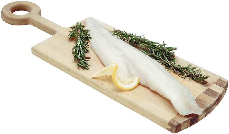 Haddock Fillet on Wooden Board with Lemon Slices Food Picture