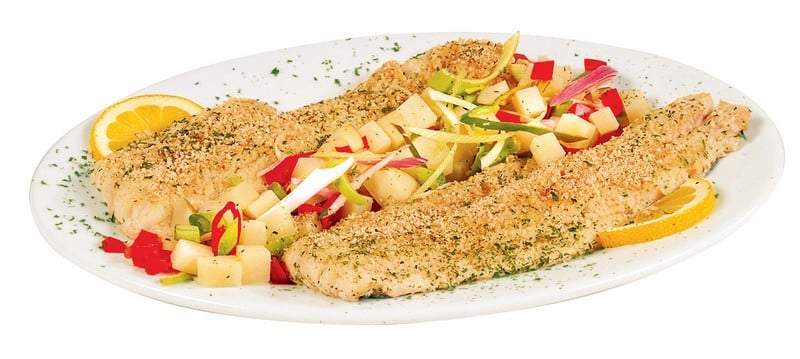 Haddock Fillet over Veggies on White Plate Food Picture