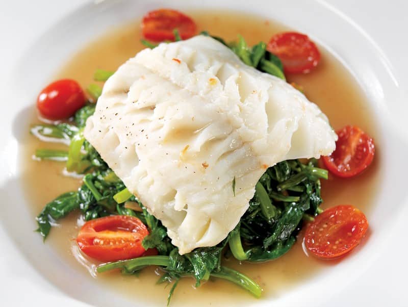 Halibut Fillet over Spinach and Tomatoes in Broth Food Picture