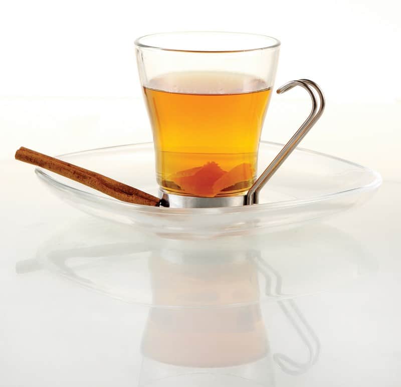 A Glass of Hot Toddy on a Plate with Cinnamon Food Picture