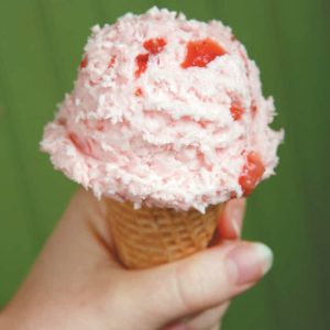 Strawberry Ice Cream in Cone with Green Background Food Picture
