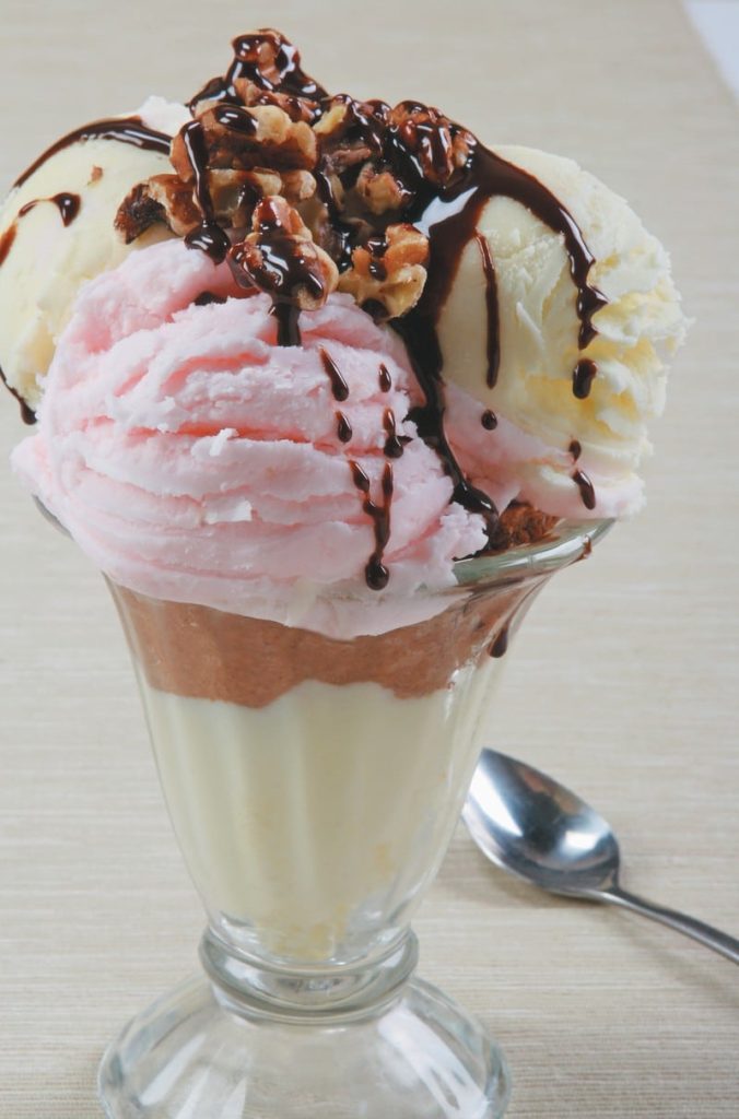 Ice Cream Sundae with Hot Fudge and Nuts in Clear Dish Food Picture