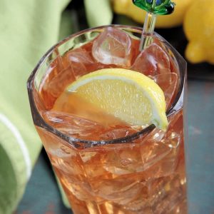 Iced Tea with Lemon Slice and Green Cloth Food Picture