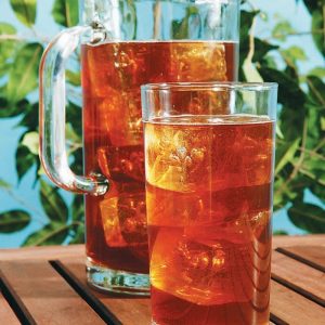 Iced Tea Pitcher and Glass on Wooden Surface Food Picture