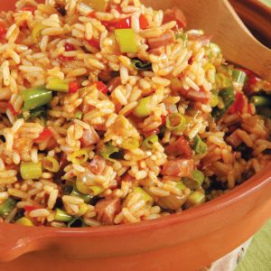 Jambalaya in Orange Dish with Wooden Spoon Food Picture