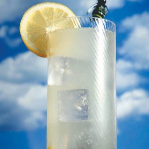 Glass on Lemonade on Wooden Surface with Cloud Background Food Picture